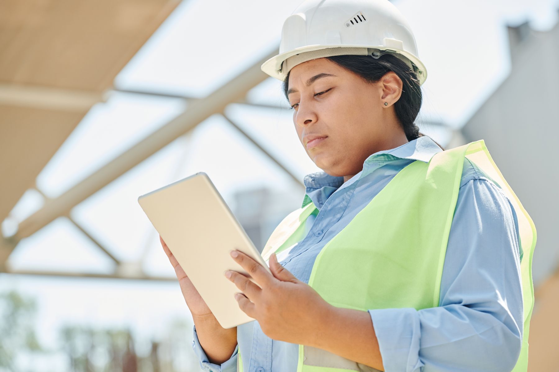 Property professional reviewing inspection documentation on a tablet